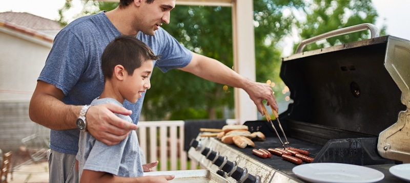 father and son grill